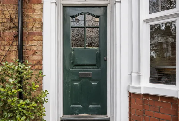 Tired front door before repainting