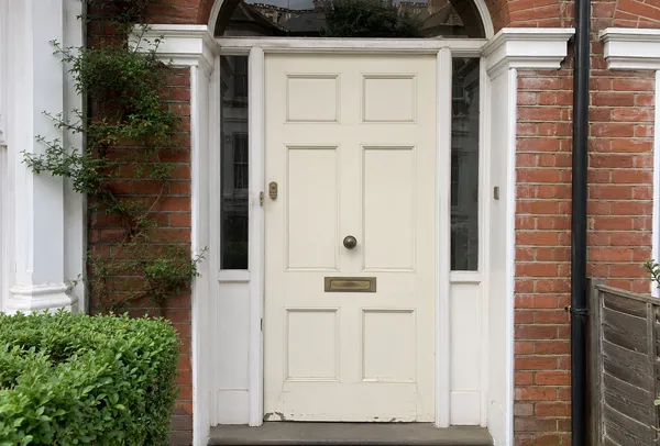 Faded front door before being repainted