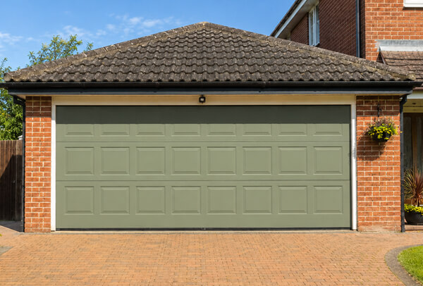 Weather faded garage door after repainting in Watford