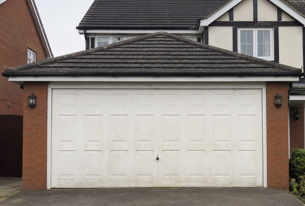 Garage door before repainting viewed from the driveway in Aylesbury