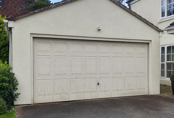 Faded garage door before painting in Aylesbury