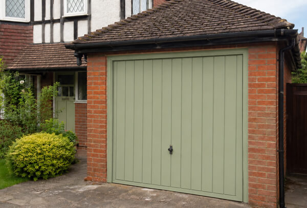 Weathered garage door after careful preparation and painting in Aylesbury