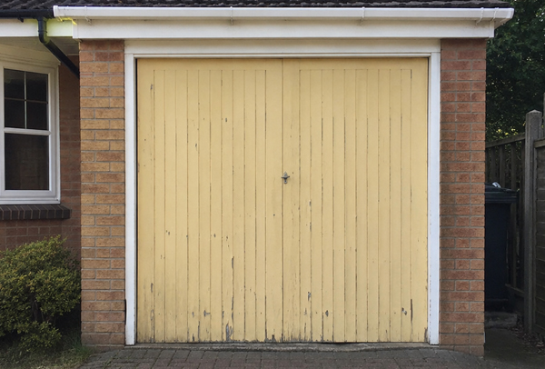 Timber garage door before painting in Dunstable