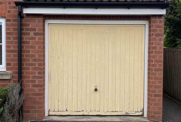 Older coloured garage door before painting in Dunstable
