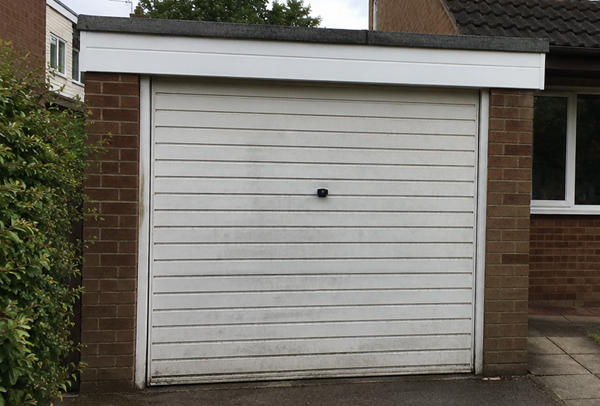 Metal garage door before repainting in Dunstable
