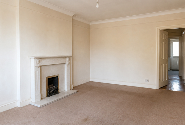 Room in Aylesbury before painter and decorator work with tired walls and older woodwork