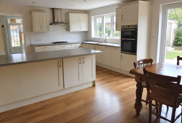 Grey gloss kitchen before cupboard spray painting in Stevenage
