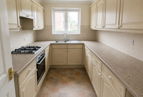 White gloss kitchen cupboards before spray painting in Stevenage