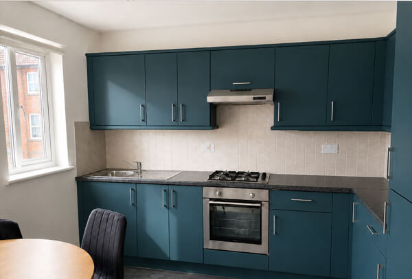 Two tone painted kitchen cabinets after refurbishment in Aylesbury