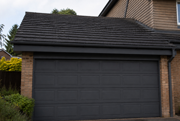 Front of property in Brackley after garage door and roofline painting