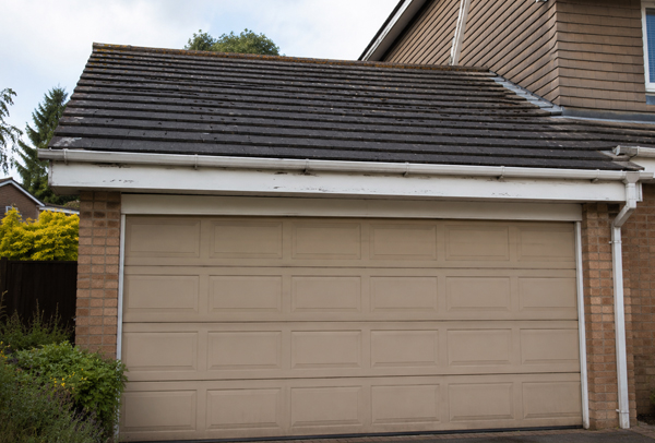 Front of property in Brackley before garage door and roofline painting