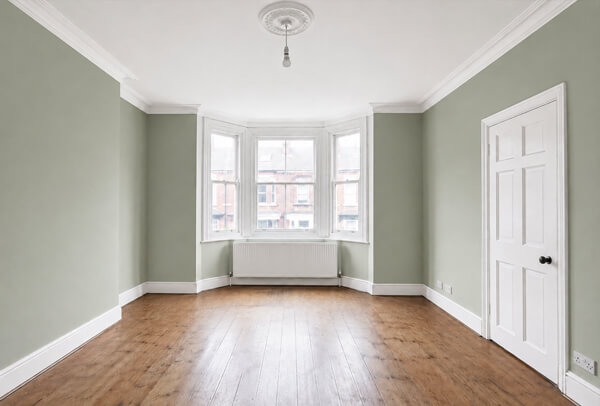 Room in Aylesbury before painting and decorating with tired walls and worn interior woodwork