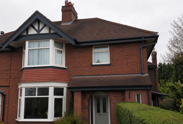 Exterior trim after painting in Houghton Regis with roofline colour matched to the home