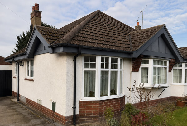 Bargeboards gutters and downpipes after painting in Aylesbury