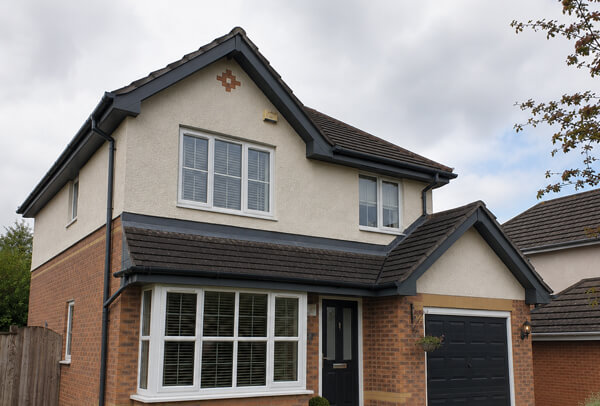 Roofline after repainting in Aylesbury showing refreshed fascias soffits and guttering